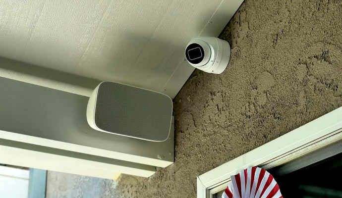 An installed surveillance camera on a wall