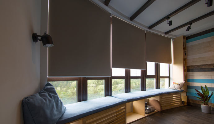  a modern room featuring motorized window coverings