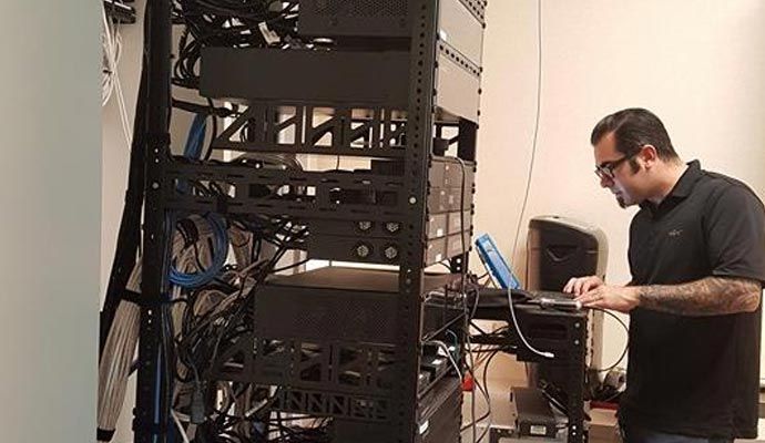 Networking system installation service Person installing networking system