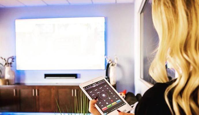 Using media control system Woman using media control system on smartphone