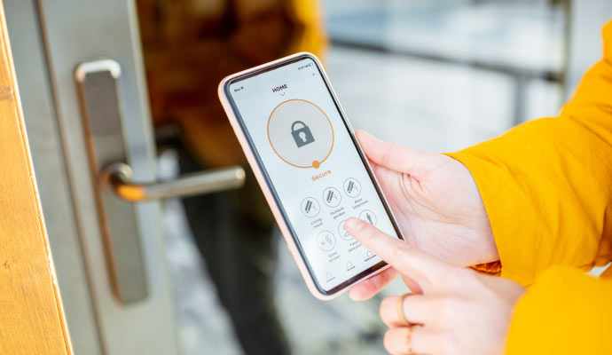 A person using phone app to operate automated door lock