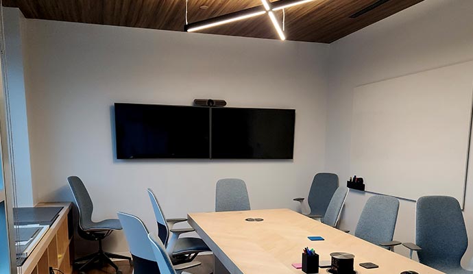 a modern conference room with a wooden table