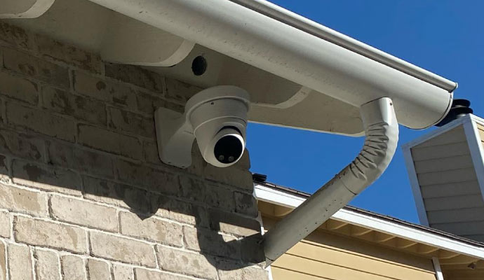 a surveillance camera mounted on the exterior of a building