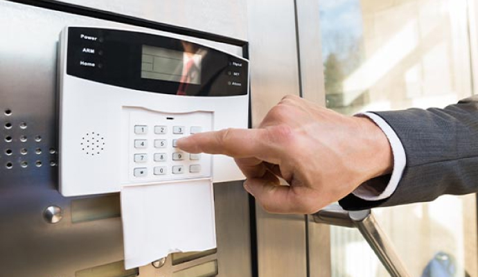 a person interacting with a security device